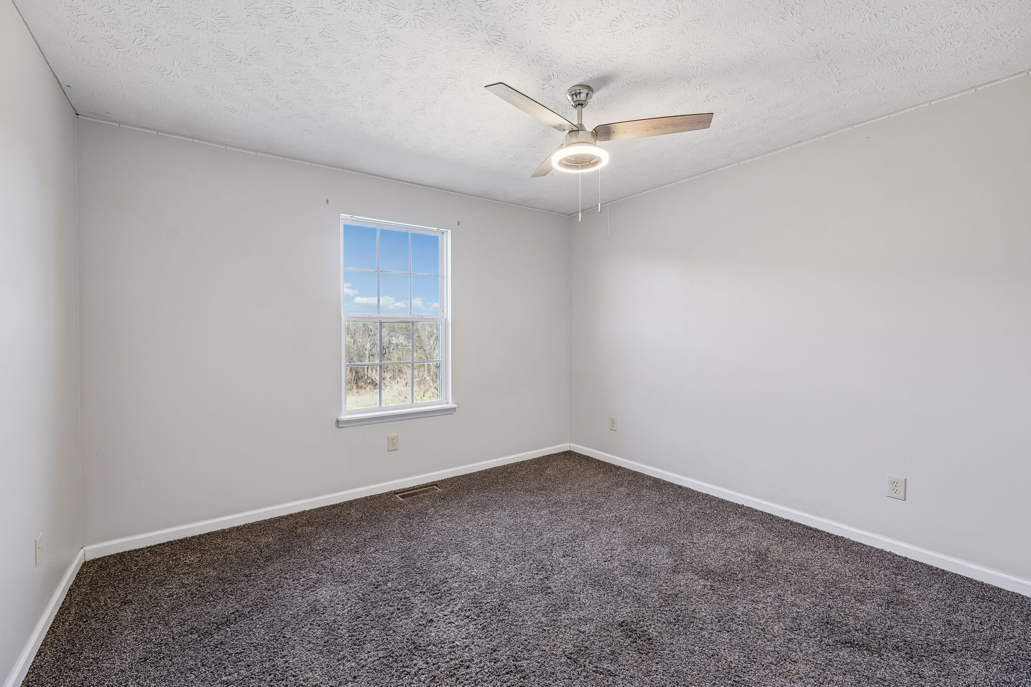 162 Pigeon Roost Road Brush Creek, TN 38547 - Photo 33 of 50 an empty room with a window