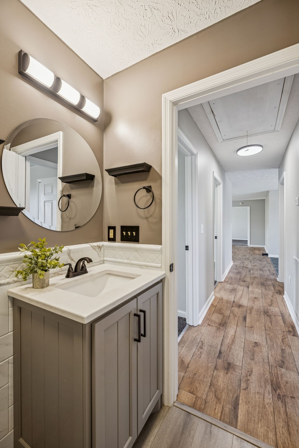 162 Pigeon Roost Road Brush Creek, TN 38547 - Photo 38 of 50 a bathroom with a sink and a mirror