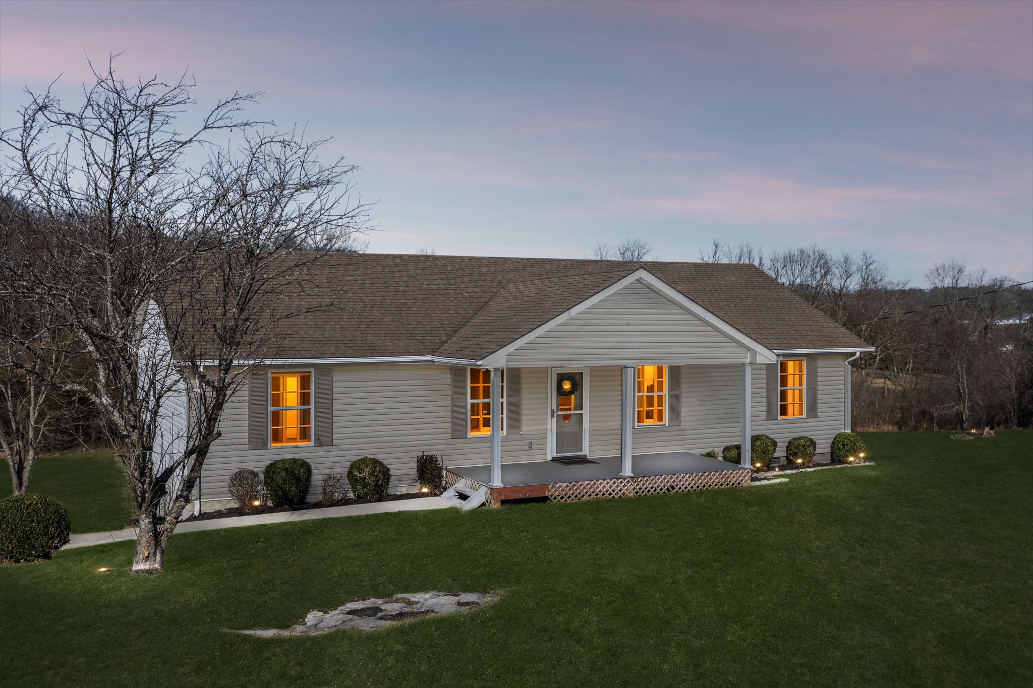 162 Pigeon Roost Road Brush Creek, TN 38547 - Photo 4 of 50 a front view of house with yard and green space
