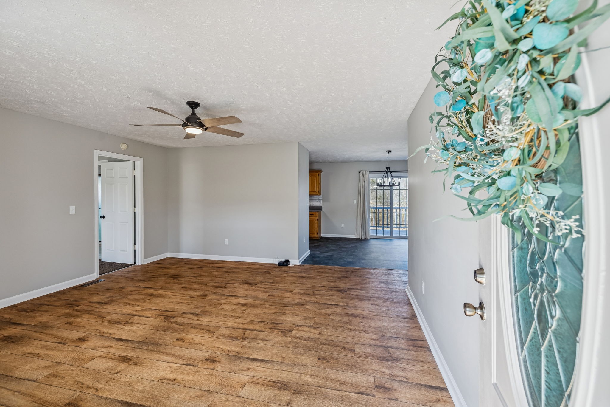 162 Pigeon Roost Road Brush Creek, TN 38547 - Photo 9 of 50 a view of a hallway with wooden floor and a plant
