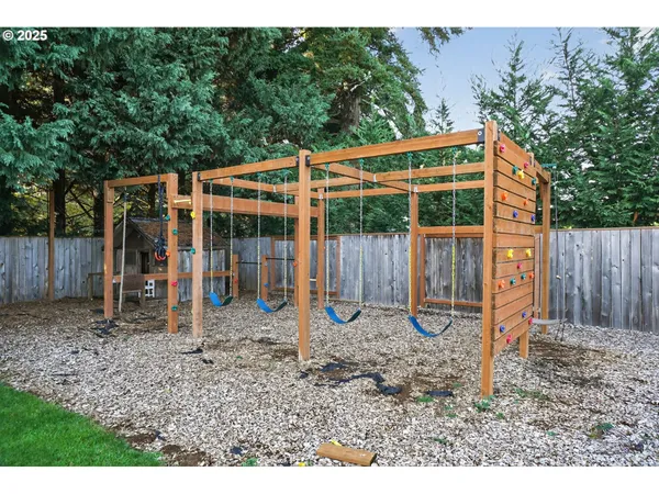 a backyard of a house with barbeque oven