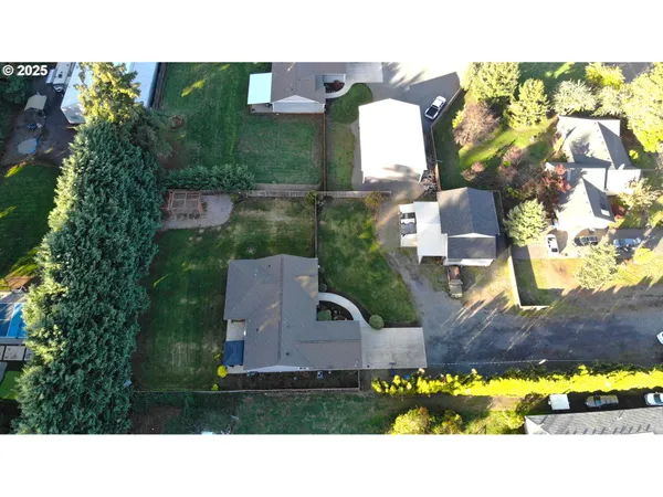 an aerial view of a house with a garden