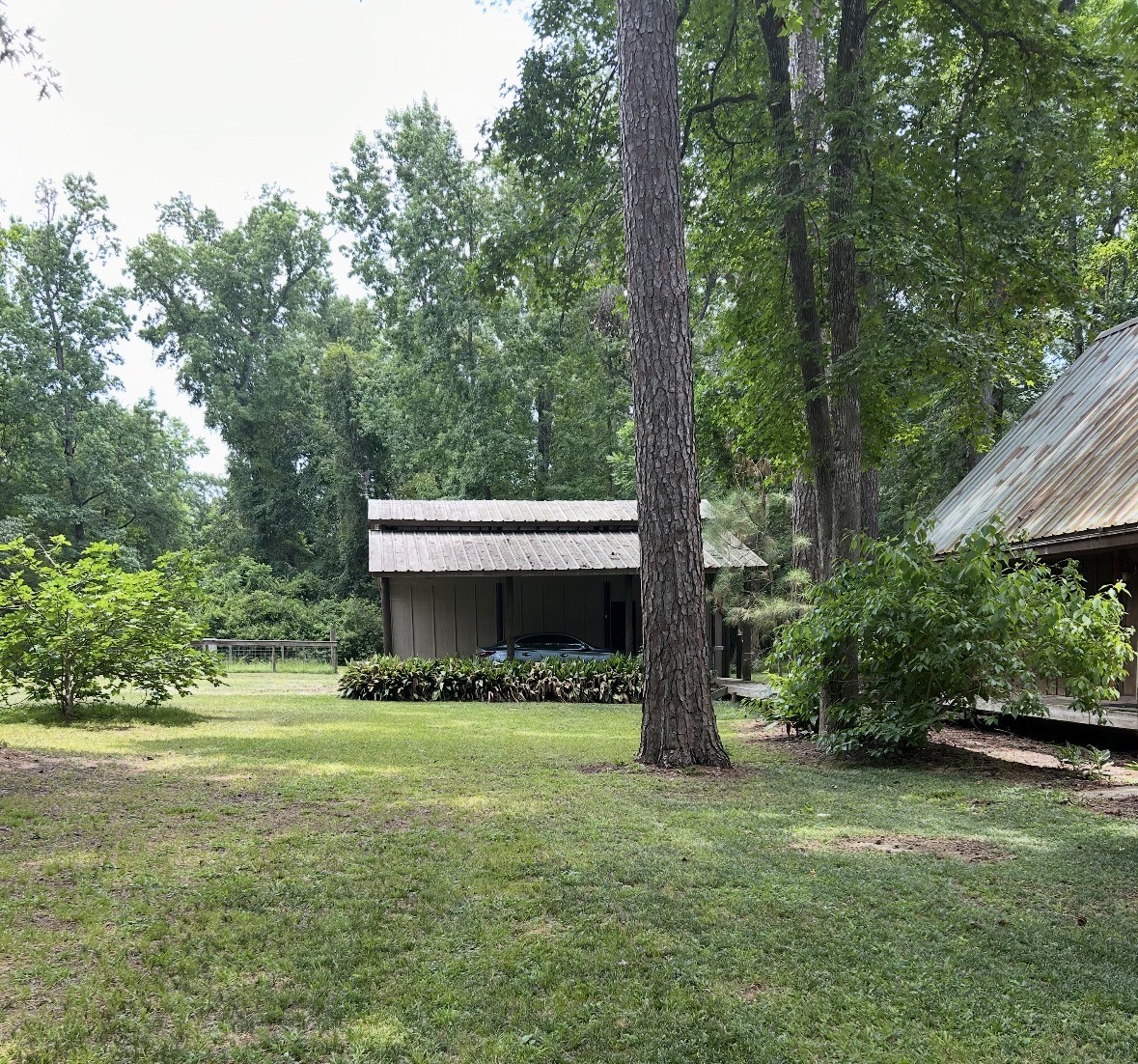 141 Walnut Loop Shepherd, TX 77371 - Photo 2 of 50 Separate garage barn area that can store your vehicles, tractor or boat.