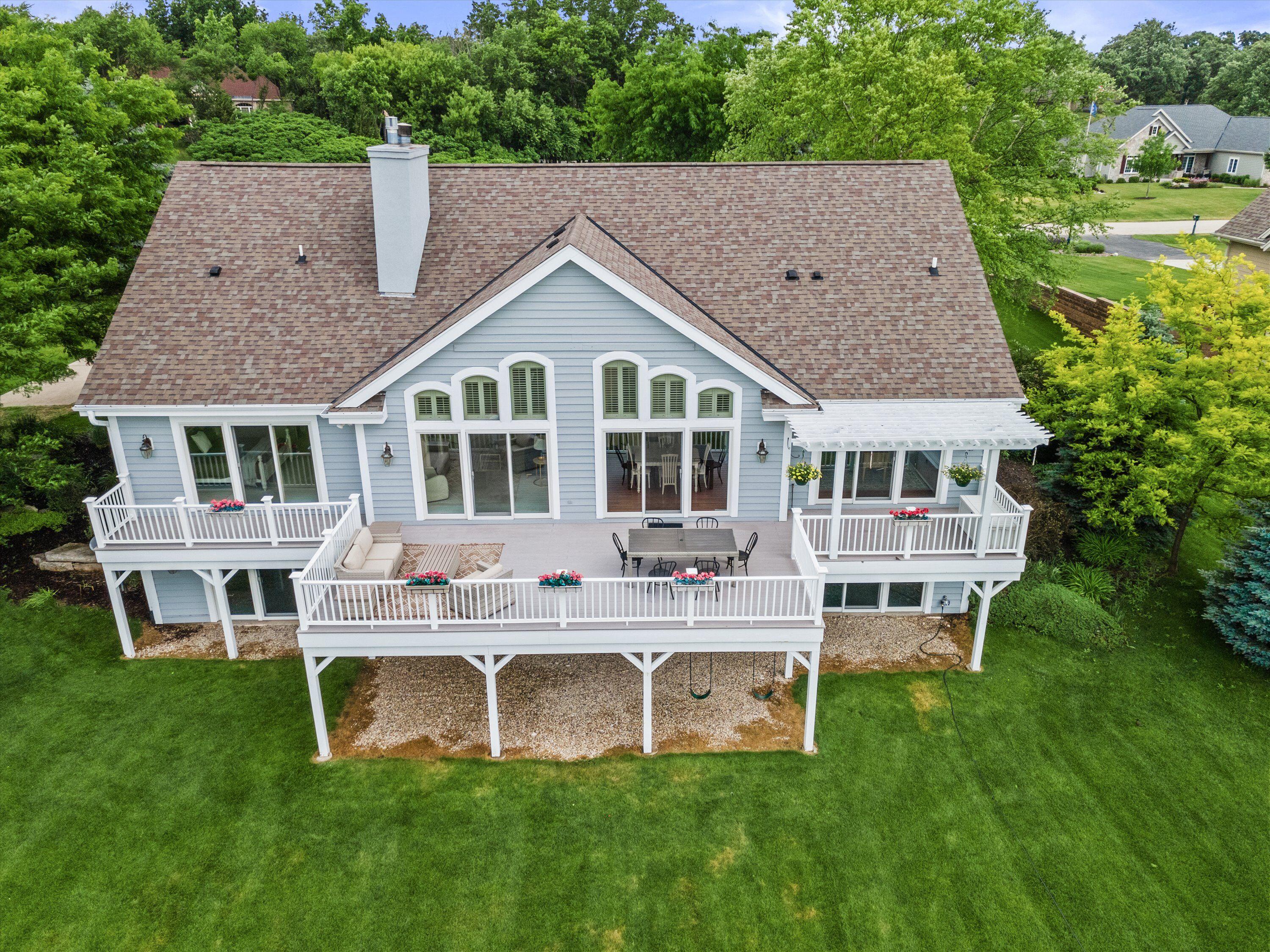 219 Muirfield Court North Prairie, WI 53153 - Photo 2 of 45 Offers Full deck on main level