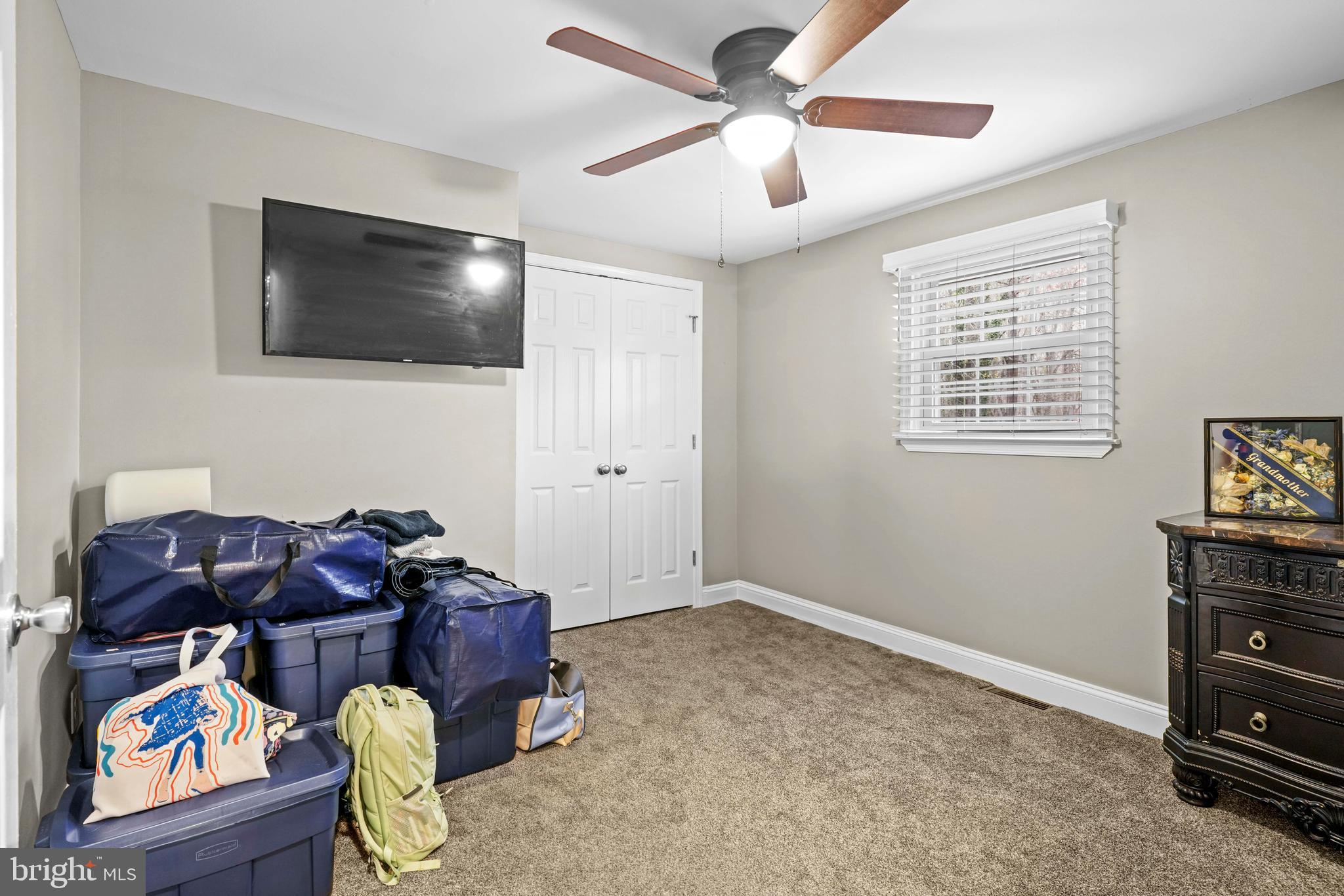 15928 Brandywine Road Brandywine, MD 20613 - Photo 11 of 40 a living room with furniture and a flat screen tv