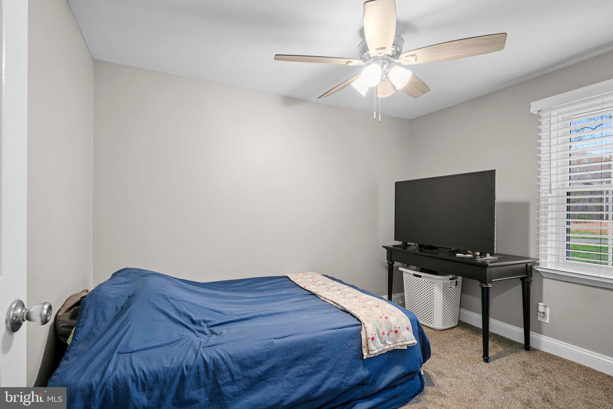 15928 Brandywine Road Brandywine, MD 20613 - Photo 12 of 40 a bedroom with a bed and a flat screen tv