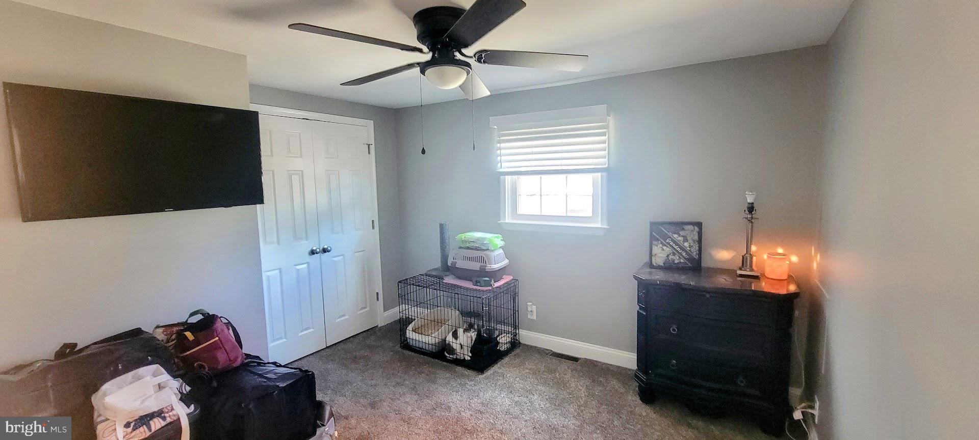 15928 Brandywine Road Brandywine, MD 20613 - Photo 16 of 40 a bedroom with bed and a chandelier