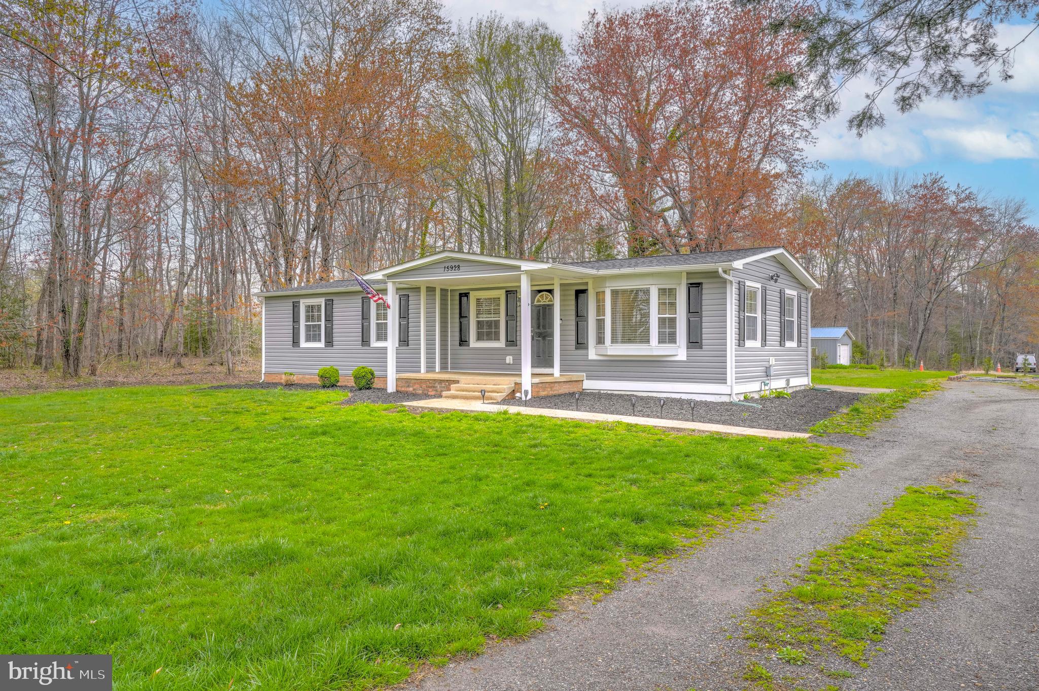 15928 Brandywine Road Brandywine, MD 20613 - Photo 32 of 40 a front view of a house with a yard table and chairs