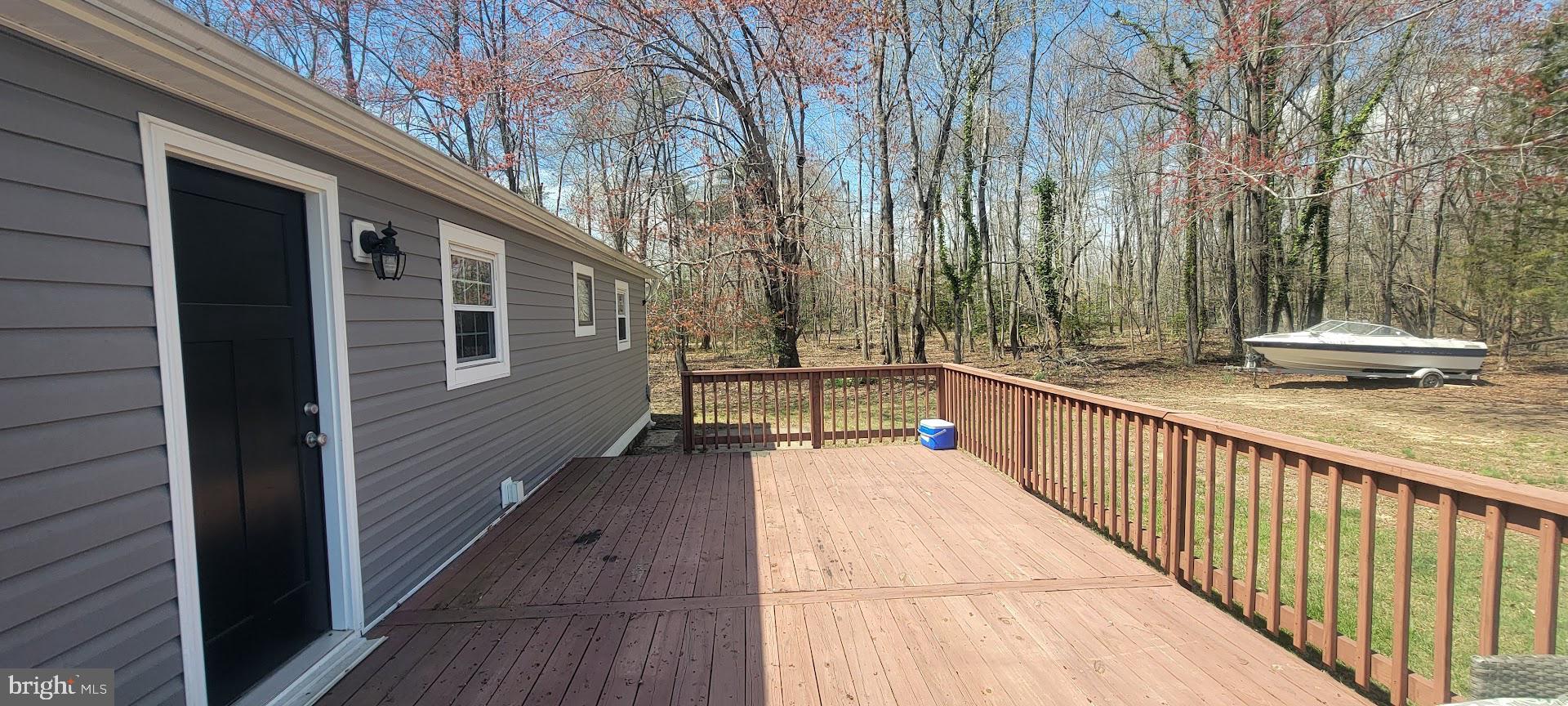 15928 Brandywine Road Brandywine, MD 20613 - Photo 38 of 40 a balcony with view of trees in the background