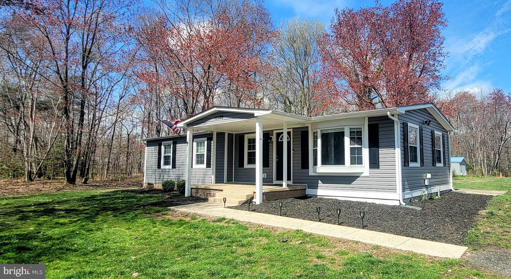 15928 Brandywine Road Brandywine, MD 20613 - Photo 40 of 40 a front view of a house with a yard and trees