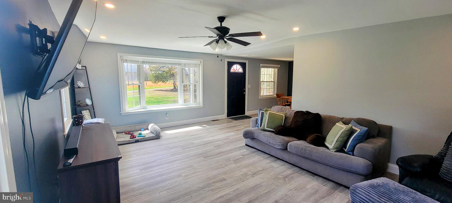 15928 Brandywine Road Brandywine, MD 20613 - Photo 5 of 40 a living room with furniture window and a ceiling fan