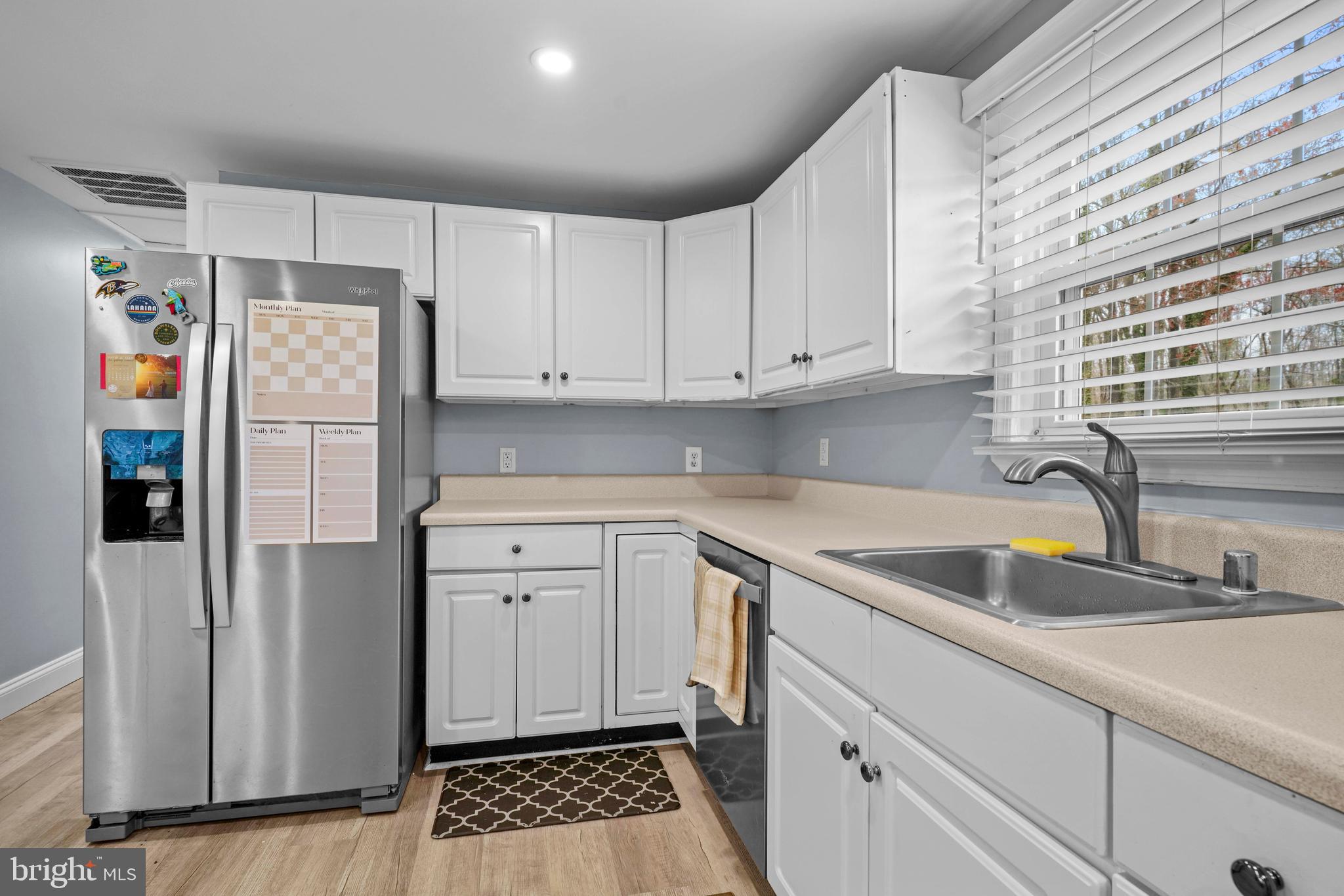 15928 Brandywine Road Brandywine, MD 20613 - Photo 6 of 40 a kitchen with a refrigerator and a sink