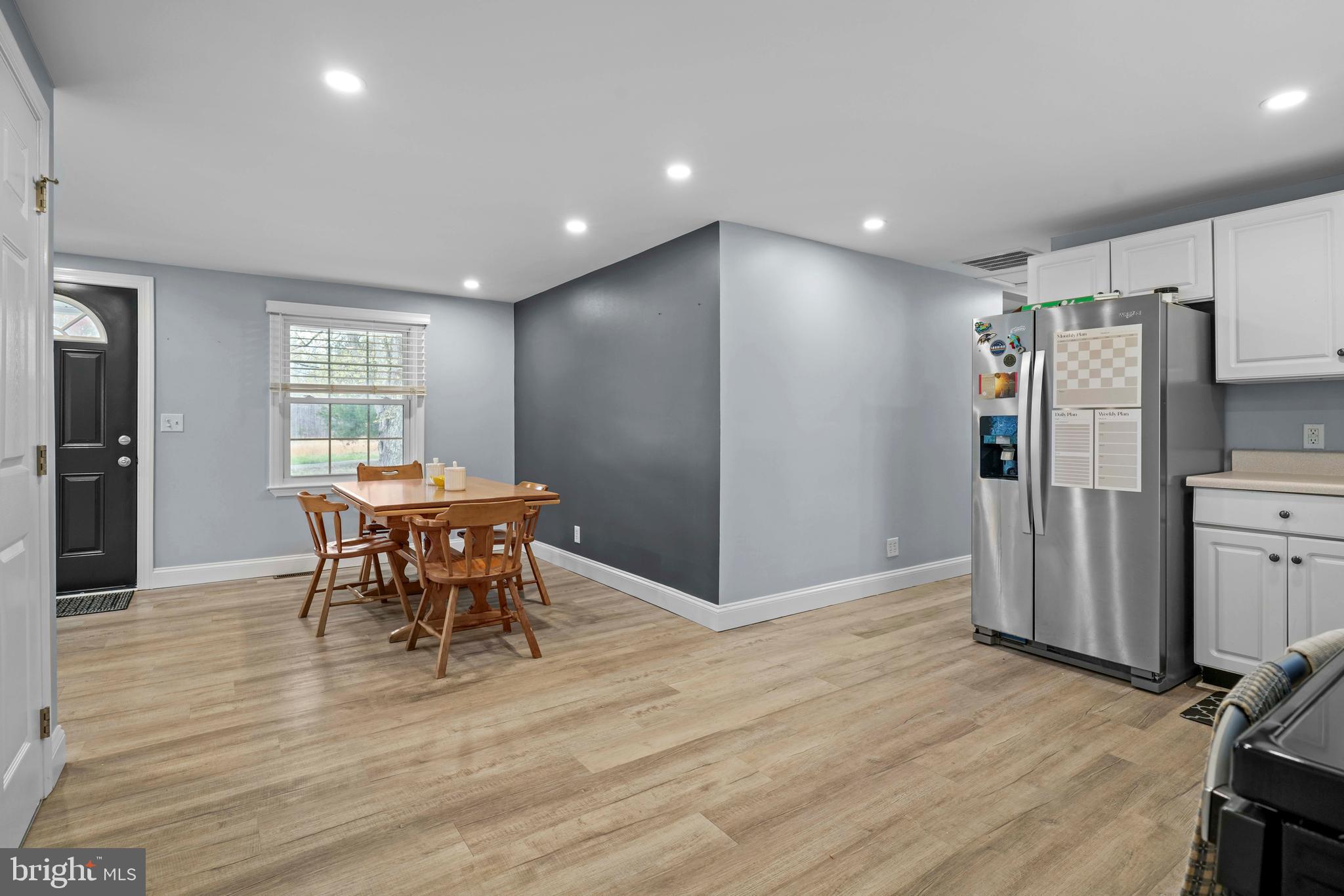 15928 Brandywine Road Brandywine, MD 20613 - Photo 9 of 40 a view of a dining room with furniture and wooden floor