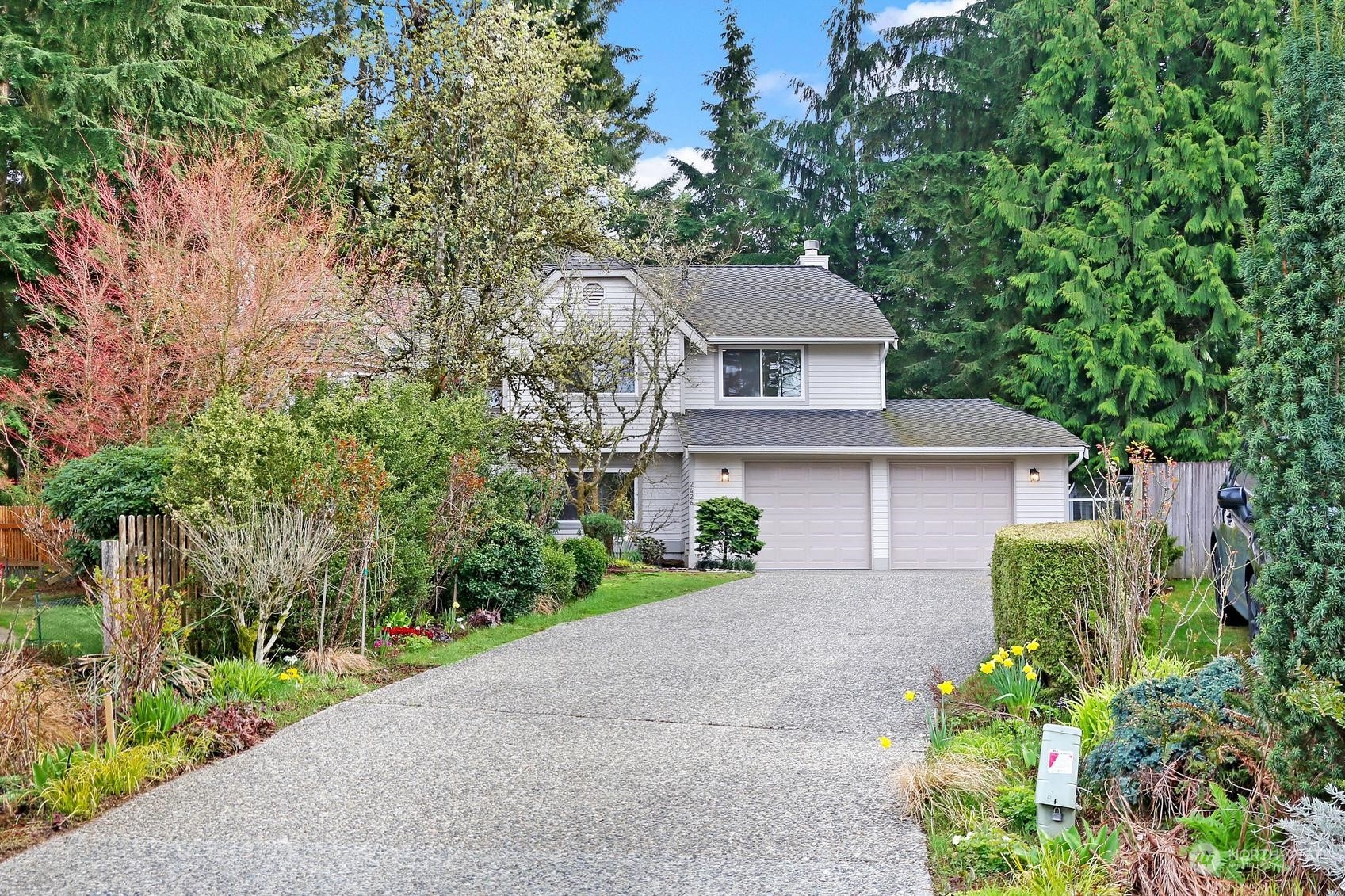 2426 243rd Place Southeast Bothell, WA 98021 - Photo 1 of 1 front view of a house with a garden