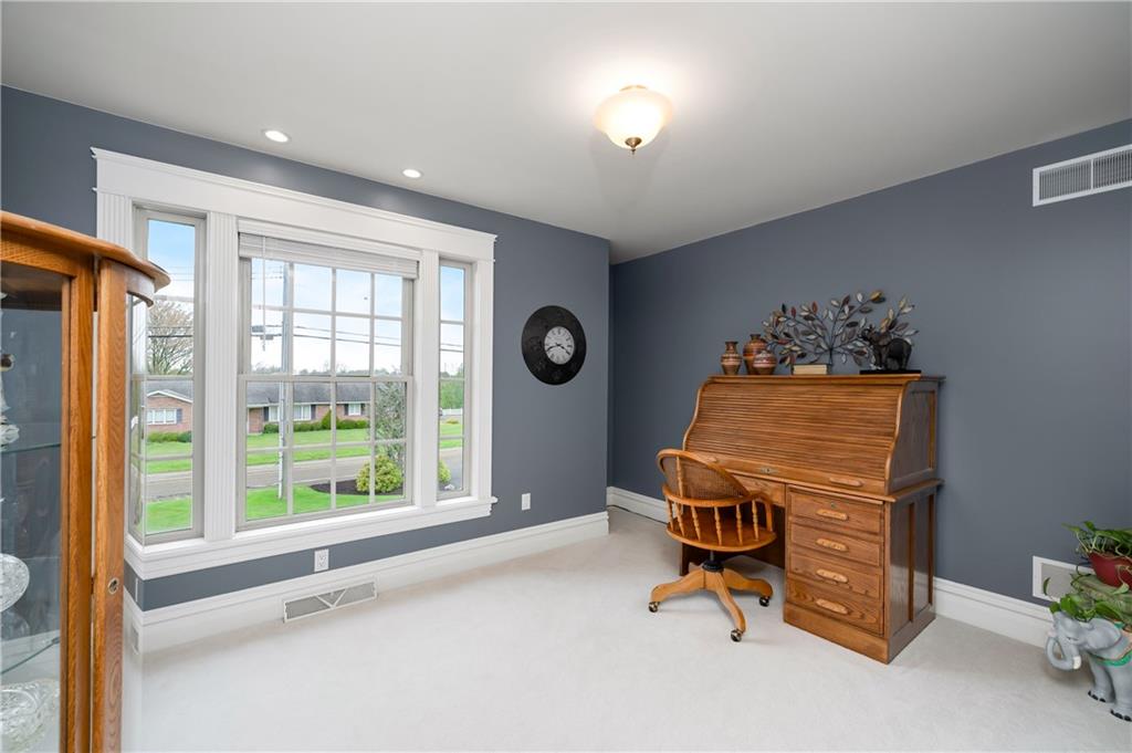 829 Hartzell School Road New Brighton, PA 15066 - Photo 24 of 50 a room with gym equipment and a large window