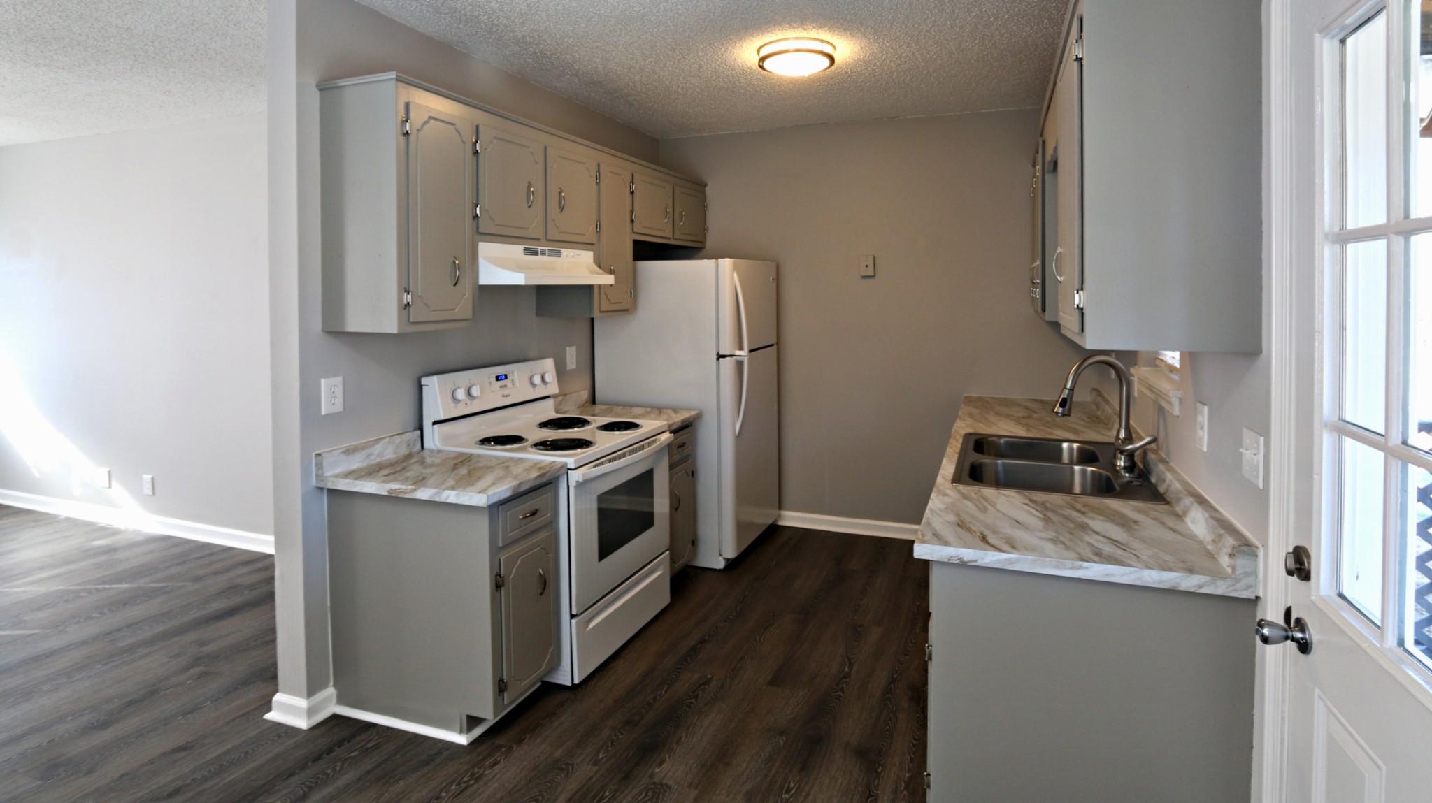 260 Hugh Hunter Road Oak Grove, KY 42262 - Photo 13 of 30 a kitchen with a stove sink and a refrigerator
