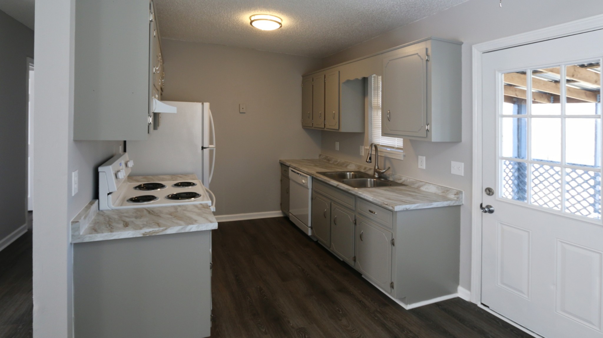 260 Hugh Hunter Road Oak Grove, KY 42262 - Photo 14 of 30 a kitchen with granite countertop a sink stove and refrigerator