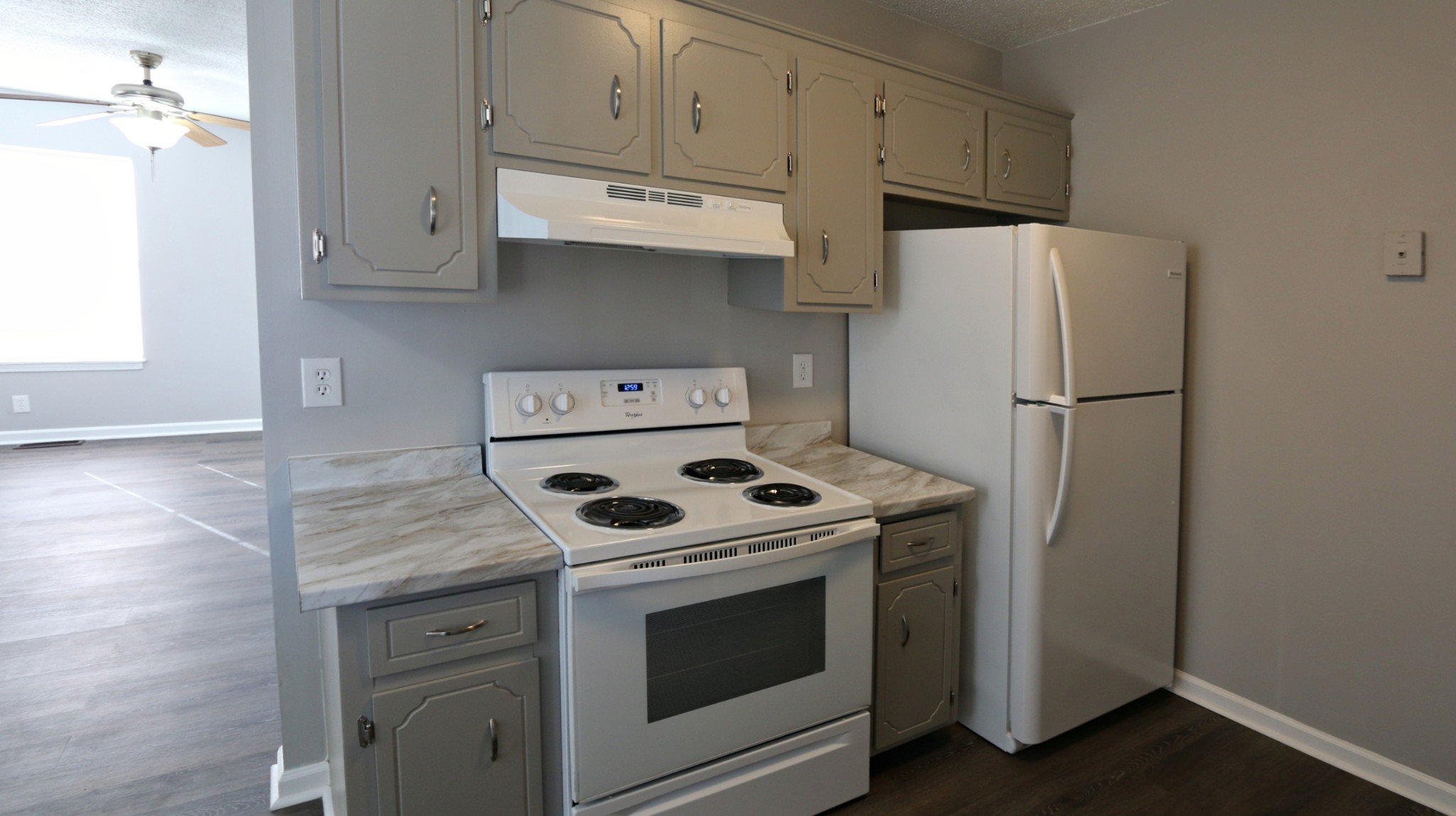 260 Hugh Hunter Road Oak Grove, KY 42262 - Photo 15 of 30 a kitchen with stainless steel appliances white cabinets and a refrigerator