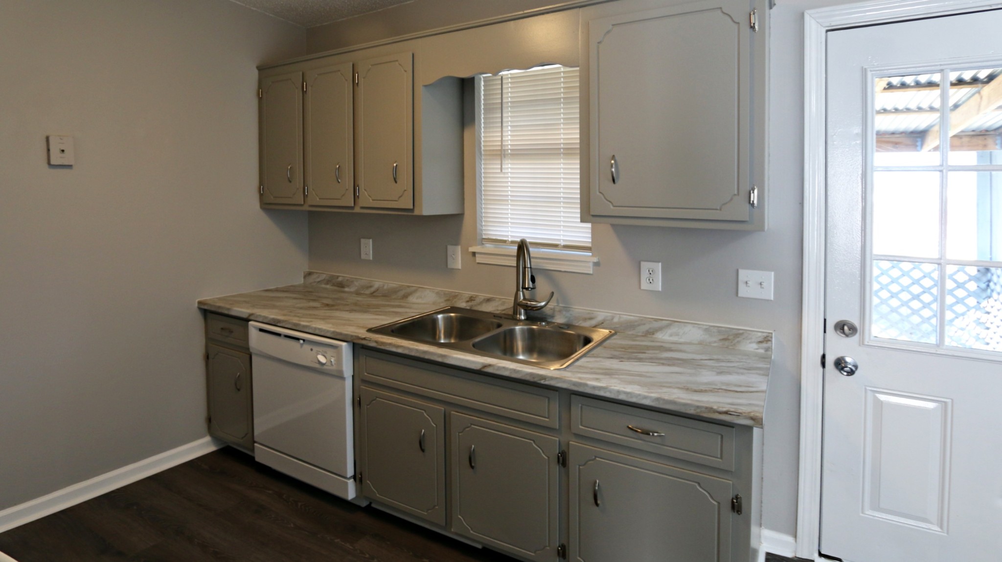 260 Hugh Hunter Road Oak Grove, KY 42262 - Photo 16 of 30 a kitchen with stainless steel appliances granite countertop a sink stove and cabinets