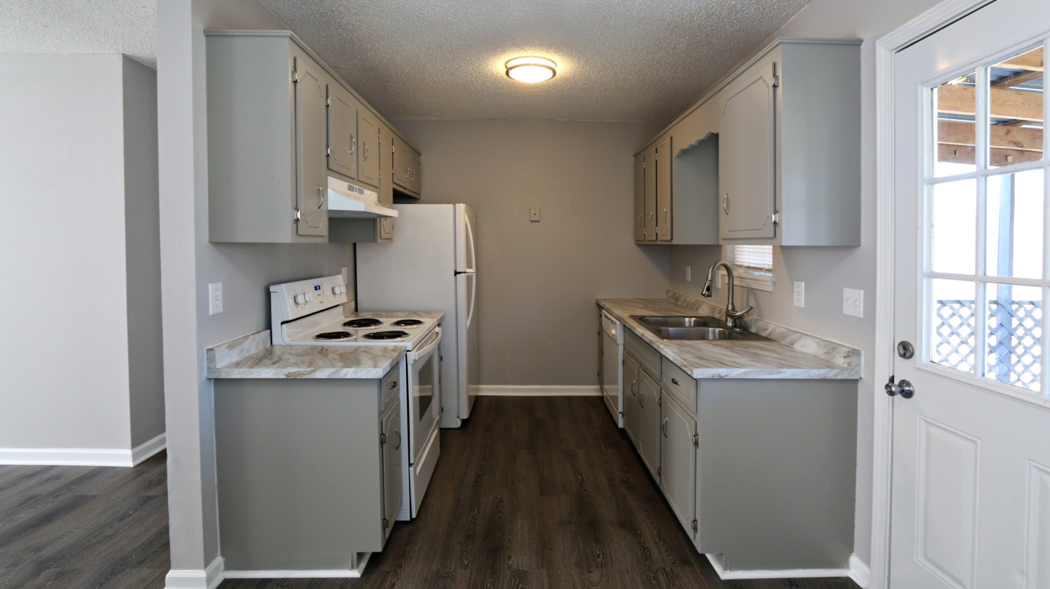 260 Hugh Hunter Road Oak Grove, KY 42262 - Photo 17 of 30 a kitchen with stainless steel appliances granite countertop a stove a sink and a refrigerator