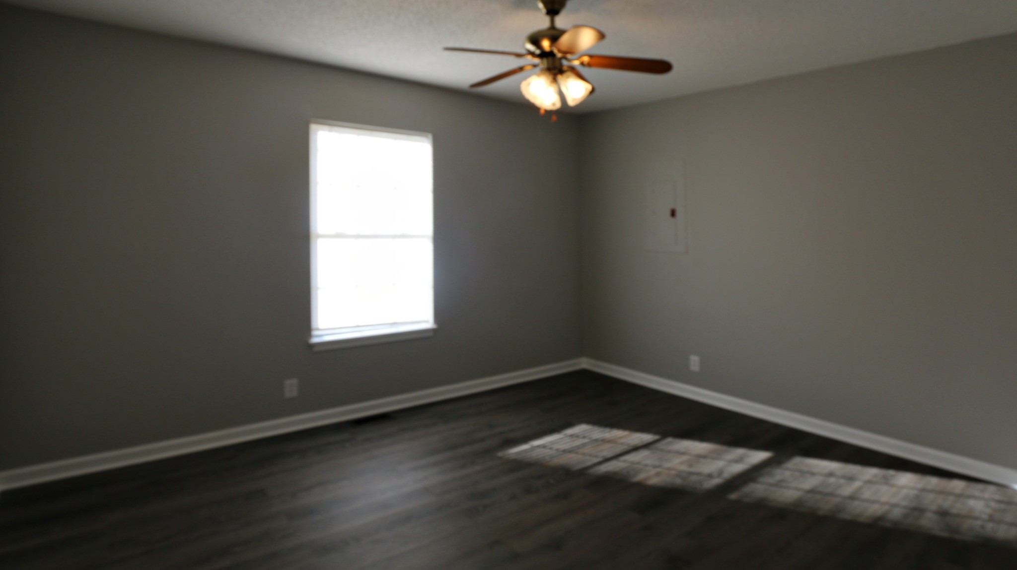 260 Hugh Hunter Road Oak Grove, KY 42262 - Photo 20 of 30 a view of a room with wooden floor and windows