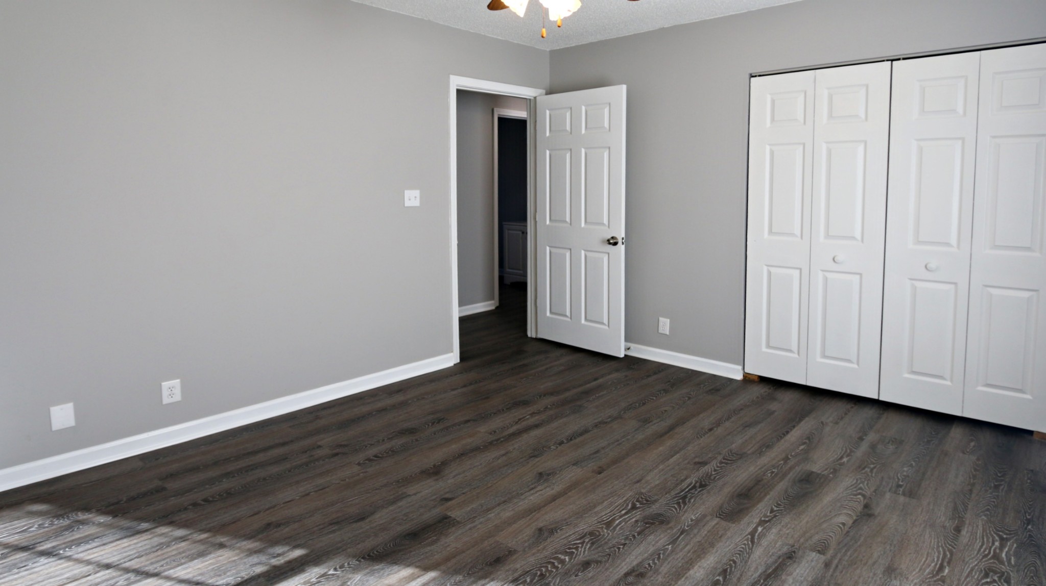 260 Hugh Hunter Road Oak Grove, KY 42262 - Photo 21 of 30 a view of an empty room with wooden floor and closet area