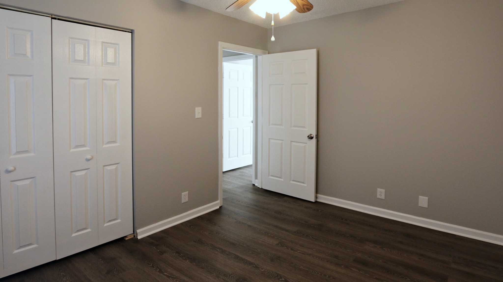 260 Hugh Hunter Road Oak Grove, KY 42262 - Photo 28 of 30 an empty room with wooden floor and closet area