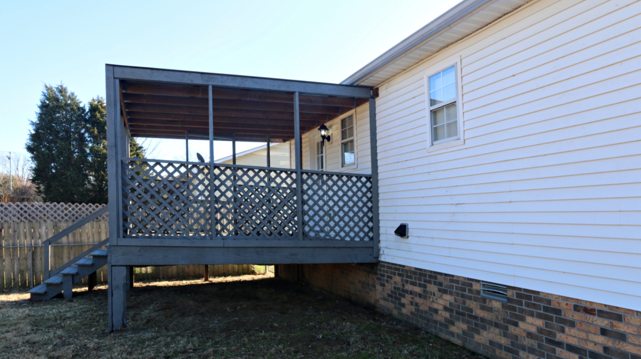260 Hugh Hunter Road Oak Grove, KY 42262 - Photo 4 of 30 a wooden bench sitting in front of a house