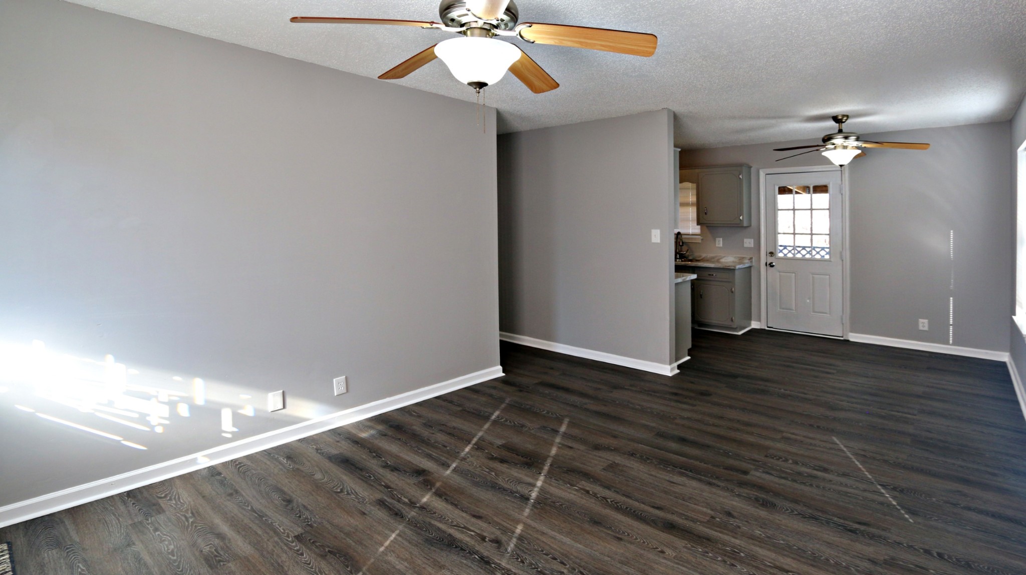 260 Hugh Hunter Road Oak Grove, KY 42262 - Photo 10 of 30 a view of an empty room with wooden floor and a window