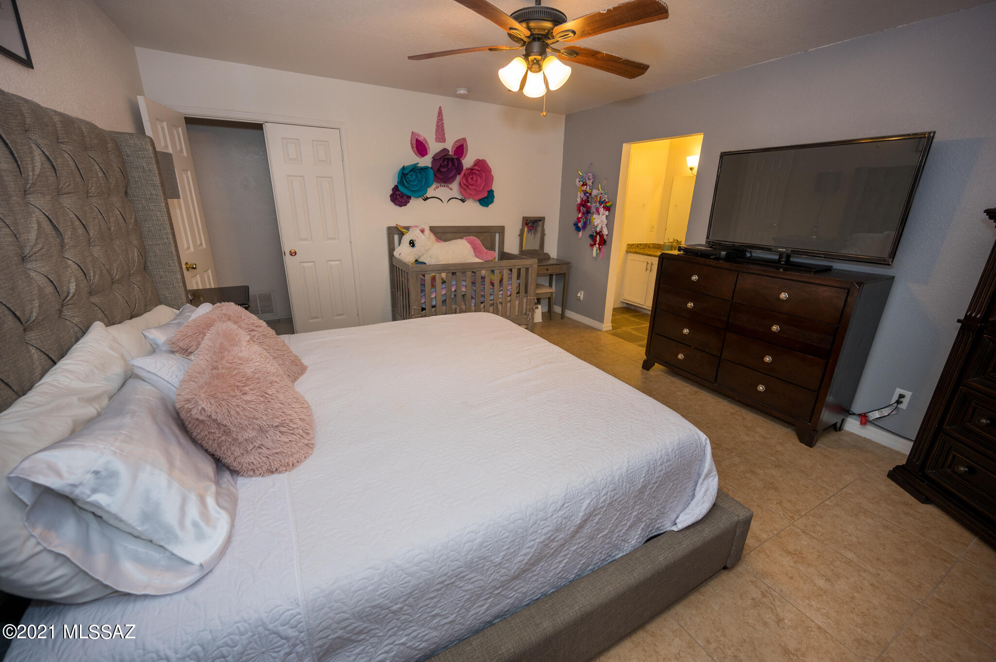 577 Camino Lito Galindo Rio Rico, AZ 85648 - Photo 17 of 19 a bedroom with a bed and a flat screen tv