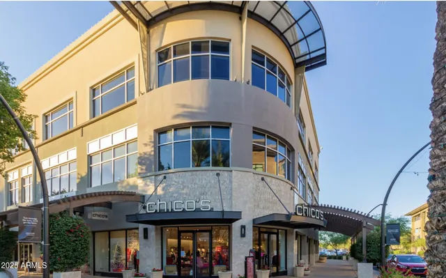 a front view of a building with garden