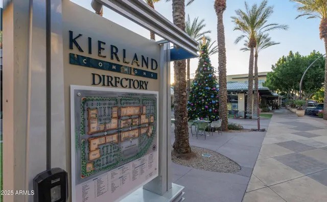 a street sign that is in front of flowers