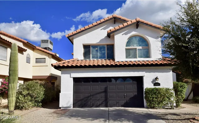 a front view of a house with a garage