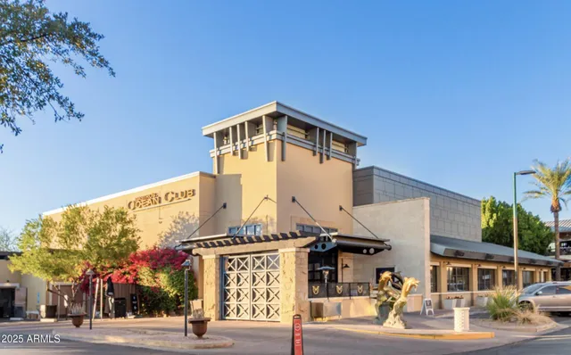 a view of yard with swimming pool and green space