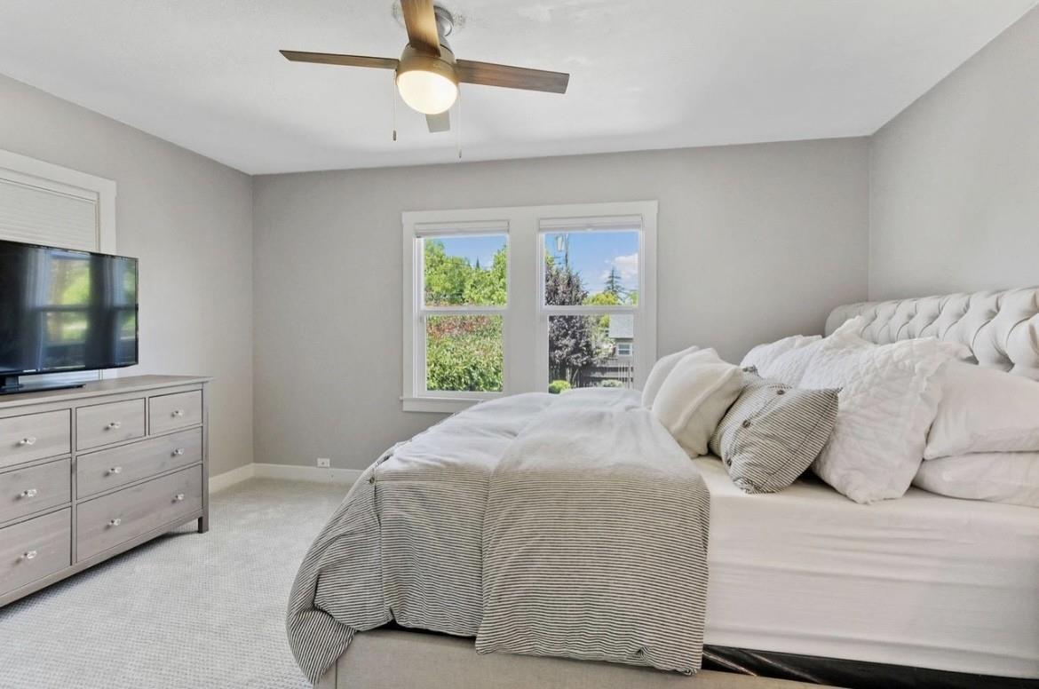500 Main Street Roseville, CA 95678 - Photo 15 of 23 a bedroom with a large bed and a flat screen tv