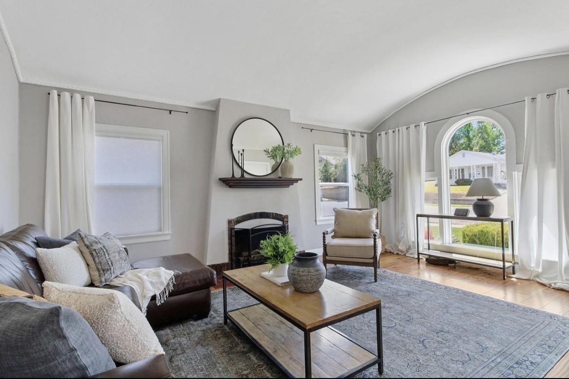 500 Main Street Roseville, CA 95678 - Photo 3 of 23 a living room with furniture a fireplace and a large window