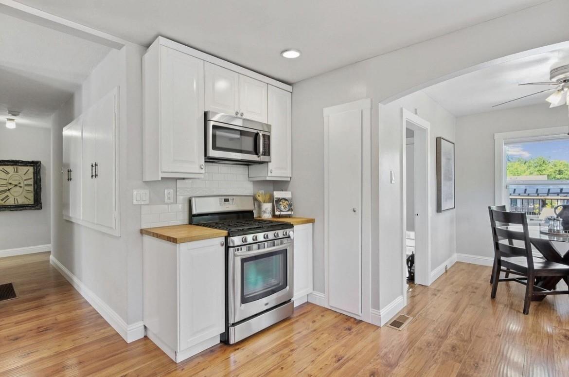 500 Main Street Roseville, CA 95678 - Photo 8 of 23 a kitchen with a stove a sink and a microwave