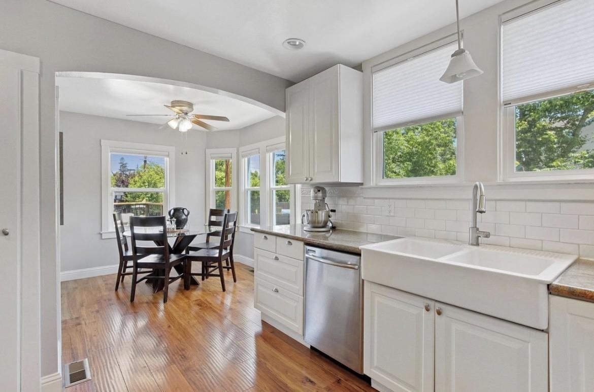 500 Main Street Roseville, CA 95678 - Photo 9 of 23 a kitchen with a table chairs sink and cabinets