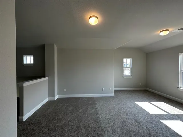 a view of a livingroom and a kitchen