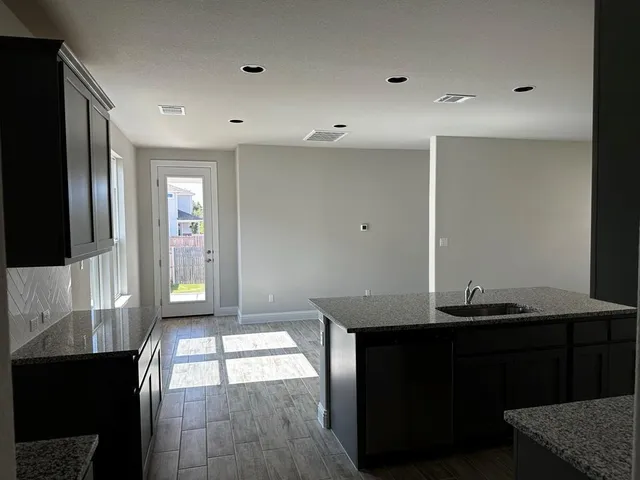 a view of hall way with furniture