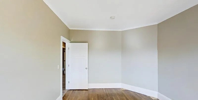 17 Ashley Street, Unit 3 Boston, MA 02130 - Photo 5 of 9 a view of hallway with wooden floor