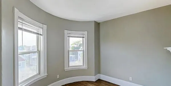 a view of a balcony with wooden floor