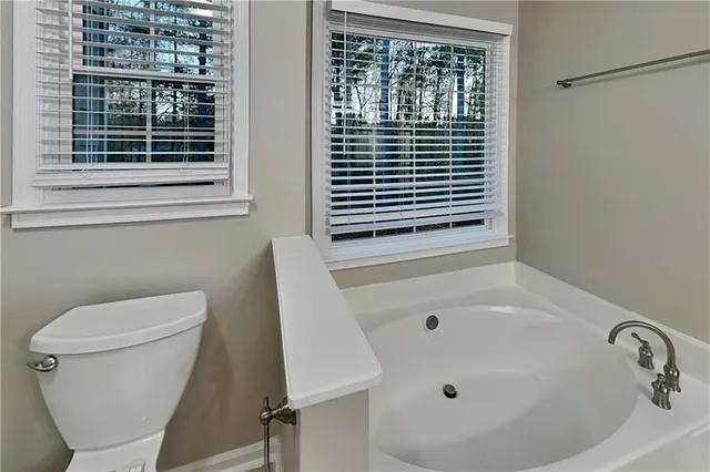 a bathroom with a toilet a sink and a bathtub