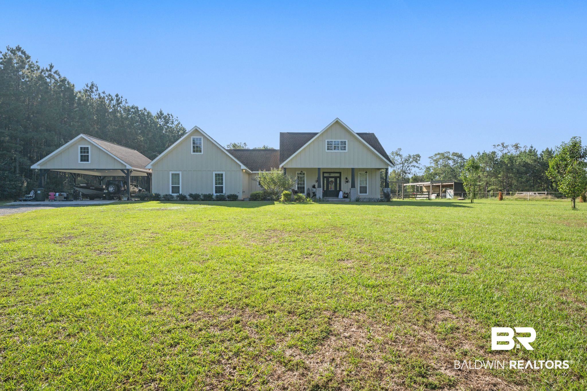 15635 North A N Brady Road Bay Minette, AL 36507 - Photo 51 of 51 View of front of property featuring a carport and a front lawn