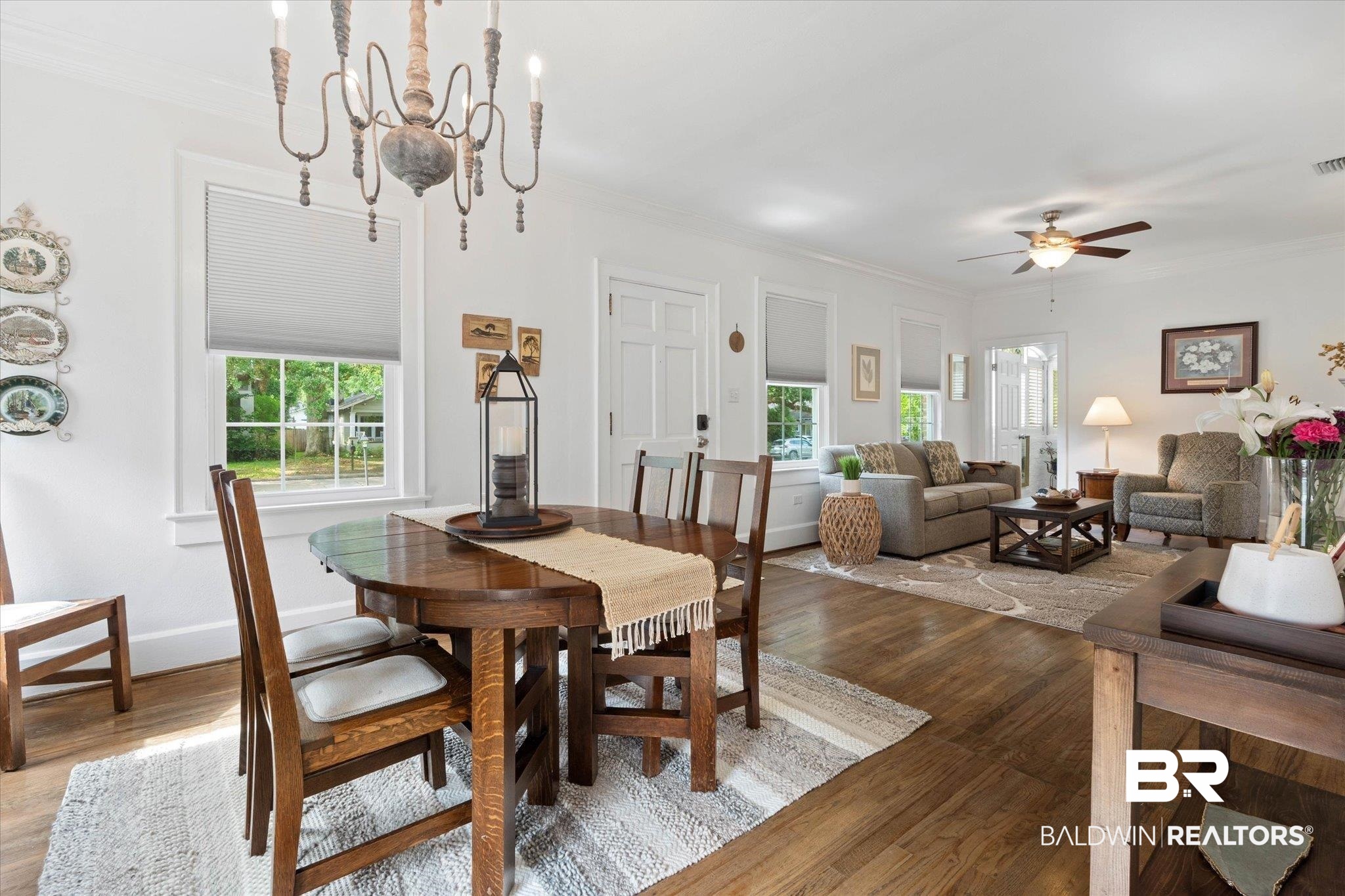 1910 Hunter Avenue Mobile, AL 36606 - Photo 6 of 21 Dining space featuring healthy amount of natural light, ceiling fan, light wood finished floors, and crown molding