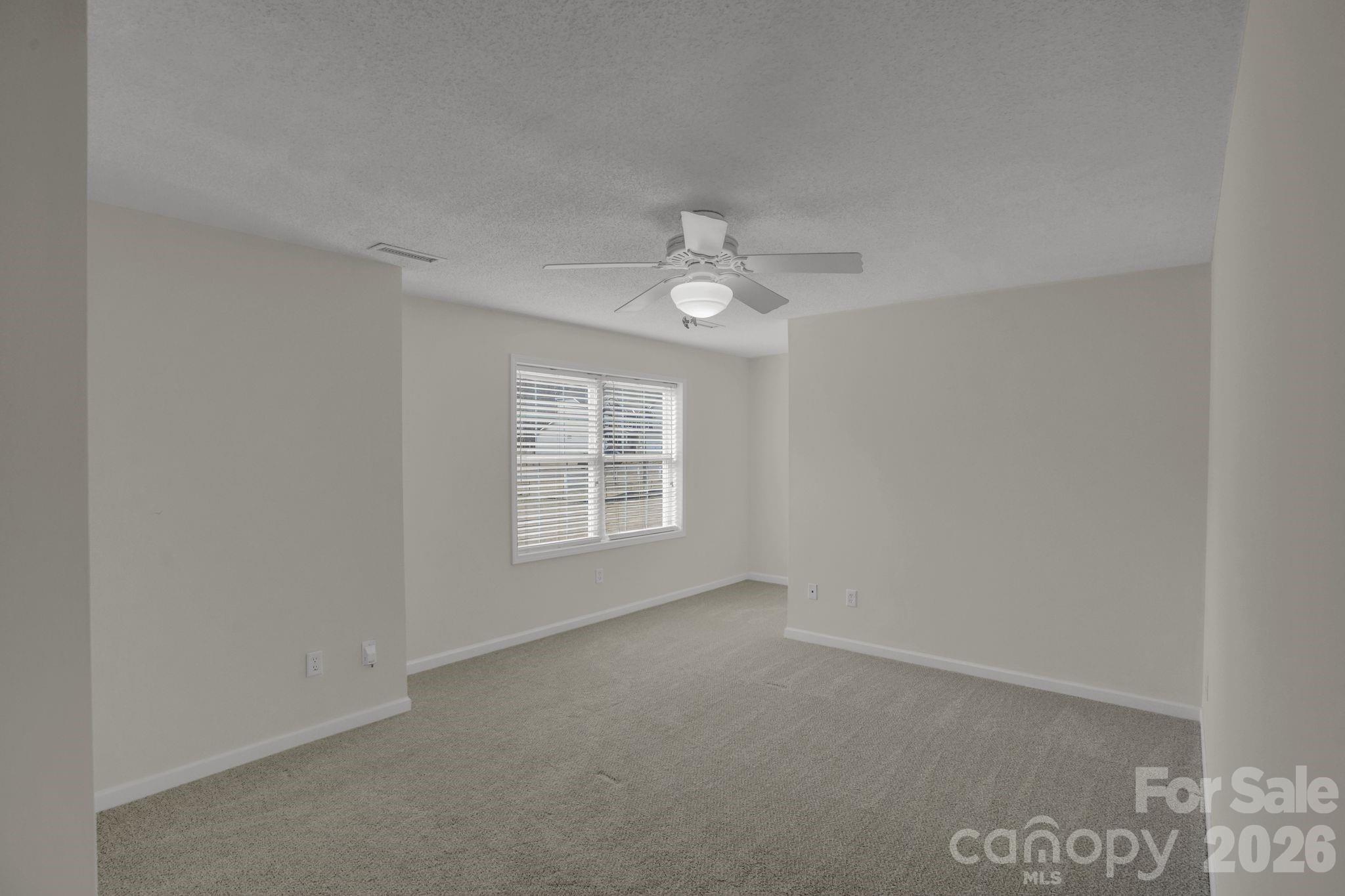 10425 Idlewild Road Matthews, NC 28105 - Photo 14 of 25 an empty room with a window