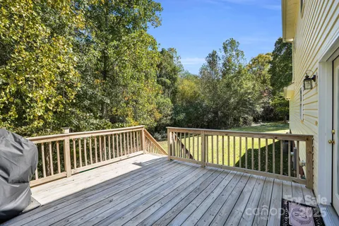 a view of balcony with wooden floor