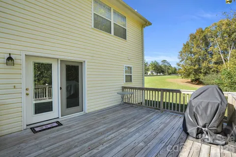 a view of deck with wooden floor and fence
