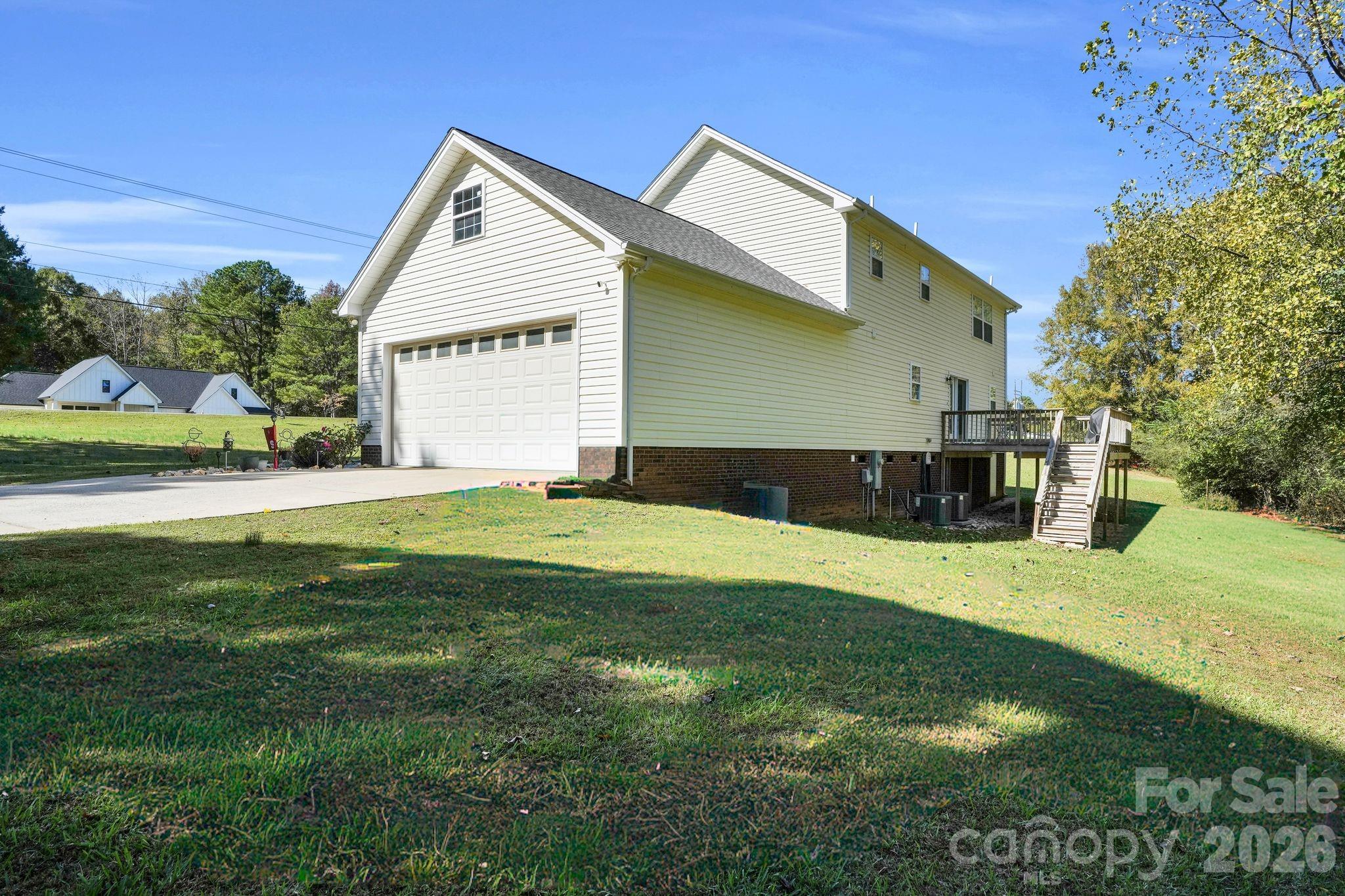 10425 Idlewild Road Matthews, NC 28105 - Photo 19 of 25 a view of a house with a yard