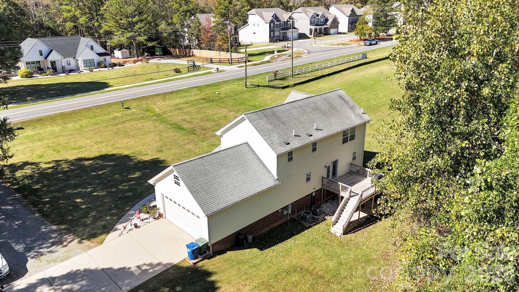 10425 Idlewild Road Matthews, NC 28105 - Photo 22 of 25 a view of a swimming pool with a yard